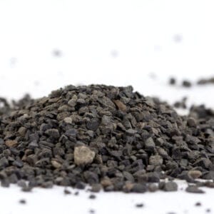 A pile of gravel on top of the ground.