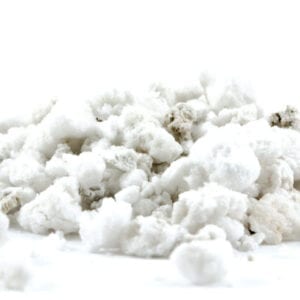 A pile of white stuff on top of the ground.